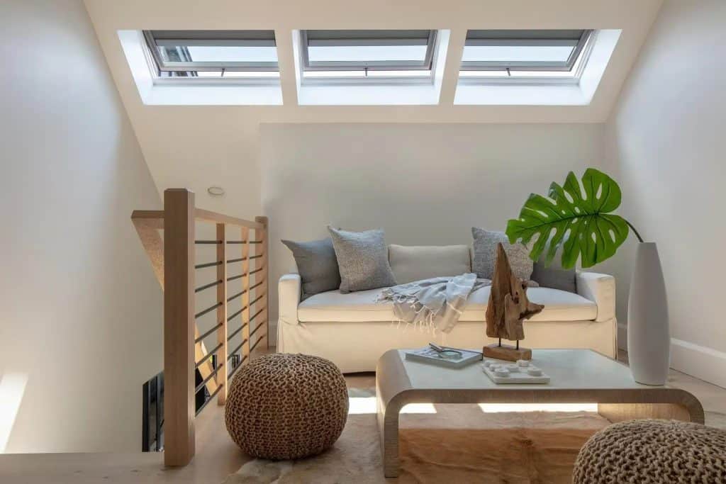 Opened Roof Window On A Small Room With Sofa